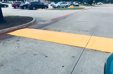 Speed bump painting in your parking lot in Tampa, FL